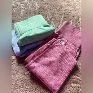 3 pair Gymshark seamless leggings in pink, mint green, and light blue. small